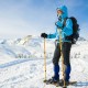 Adult using 4-in-1 lightweight terrain snowshoes with ski poles in snowy landscape, designed for maximum flotation and.